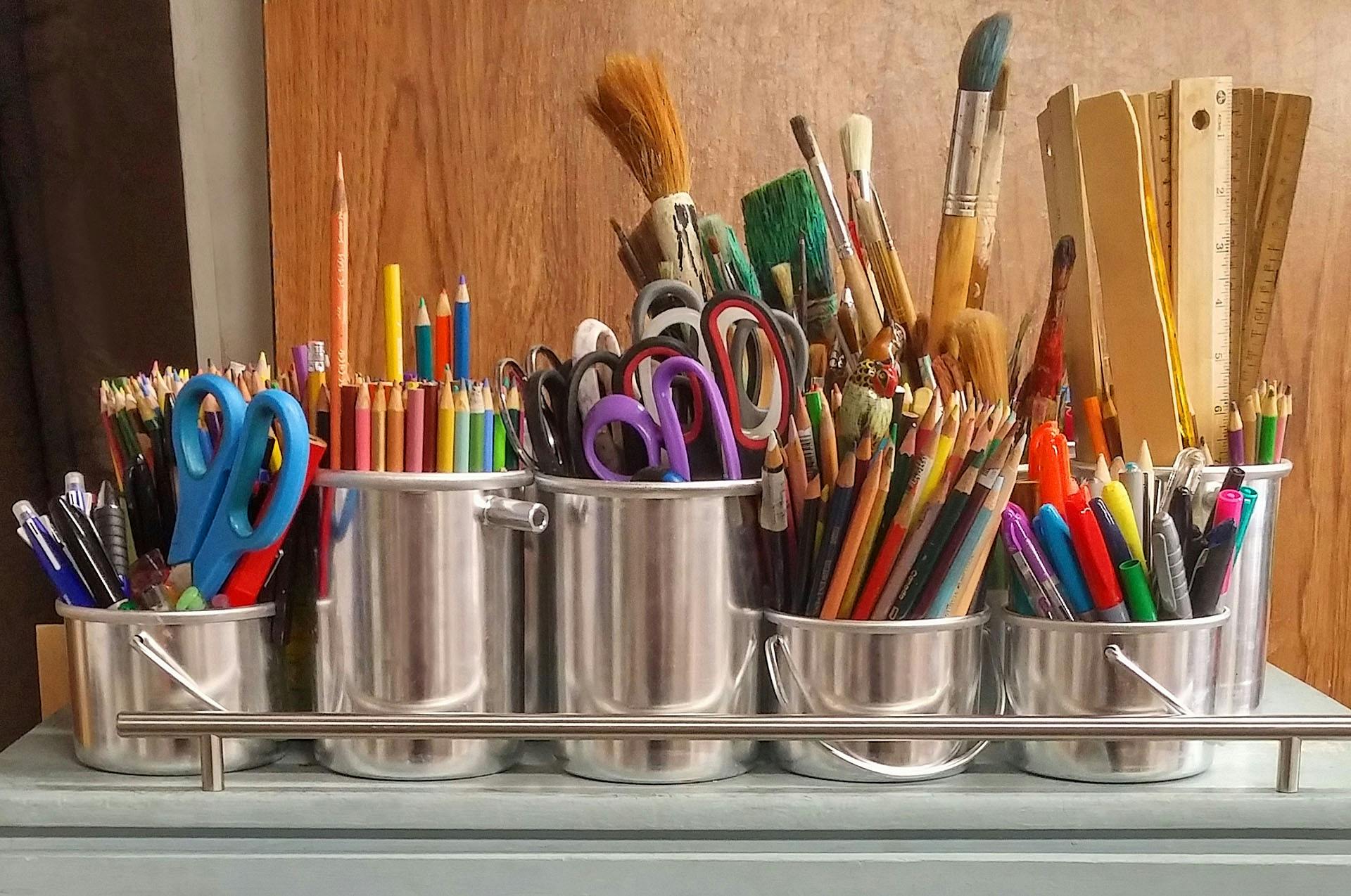 A child exploring a colourful art activity