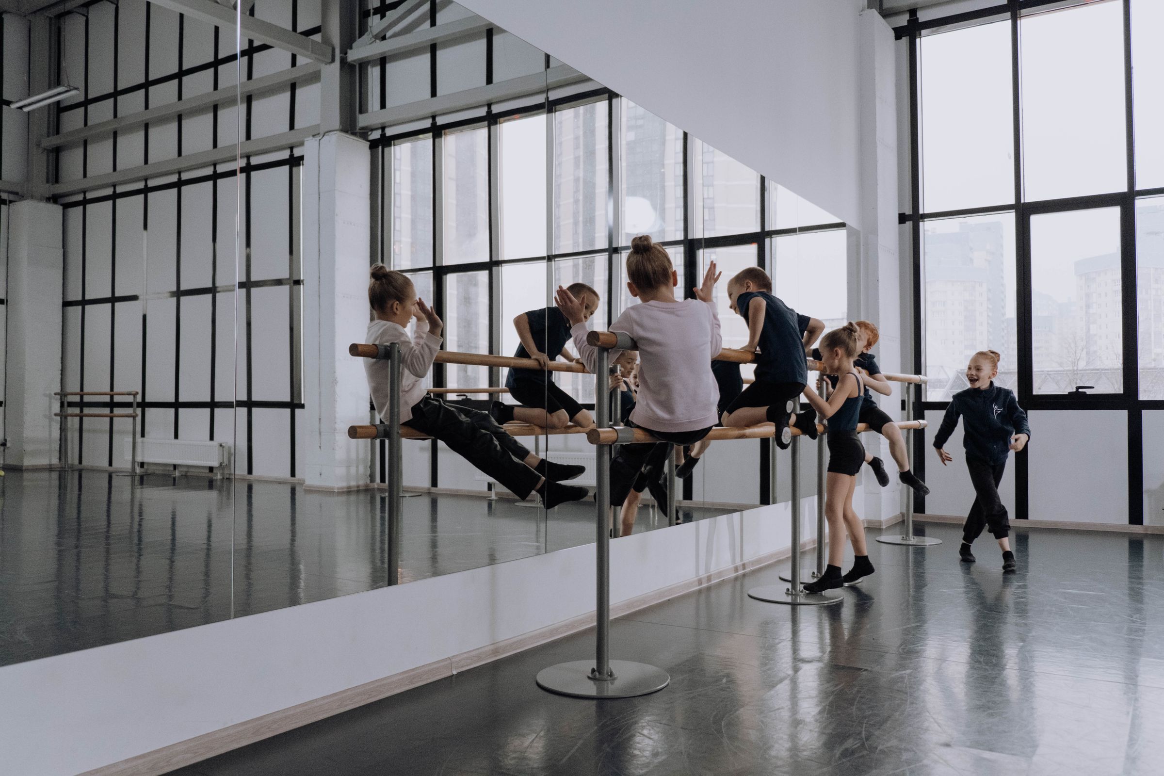 Children learning together in a dance studio